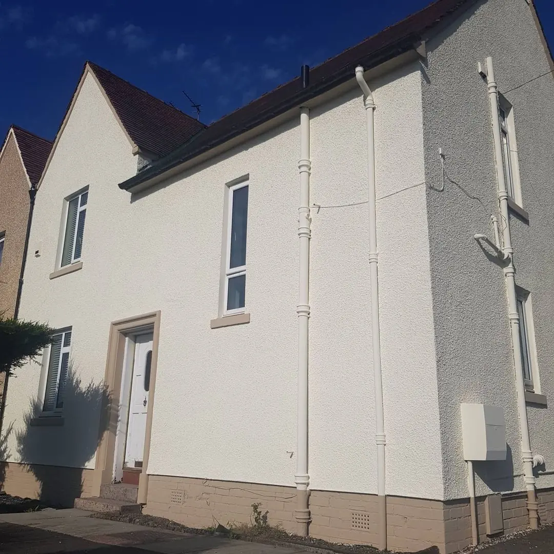 The same house after cleaning and façade coating