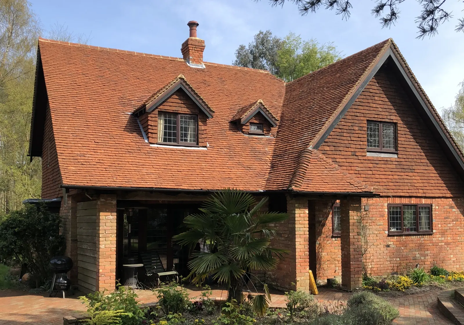 The same roof cleaned back to terracotta
