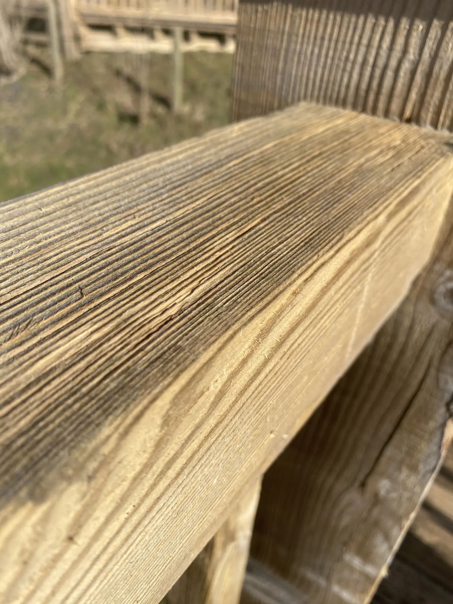 The same rail cleaned back to bare timber
